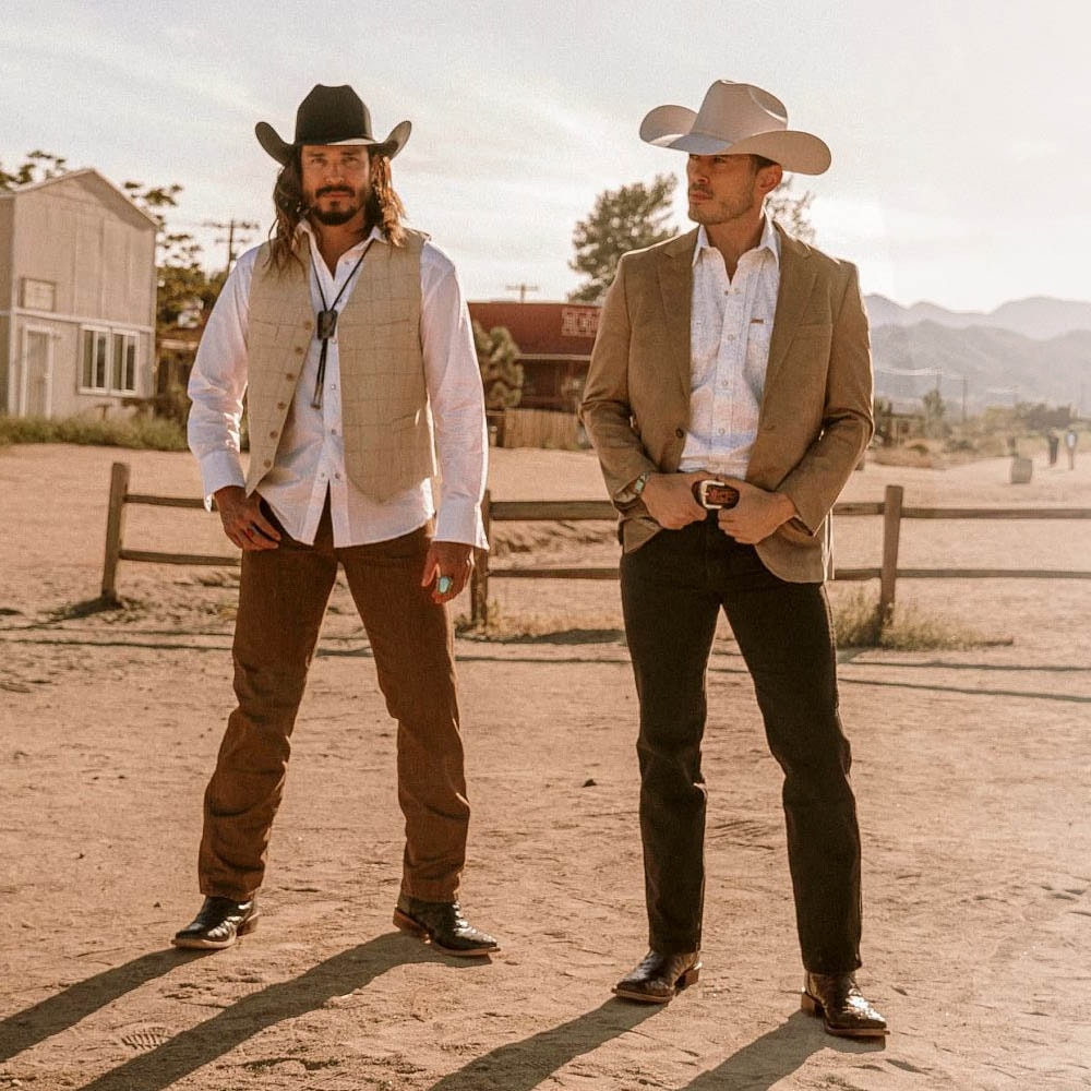 Two men wearing El Paso styles in the desert.